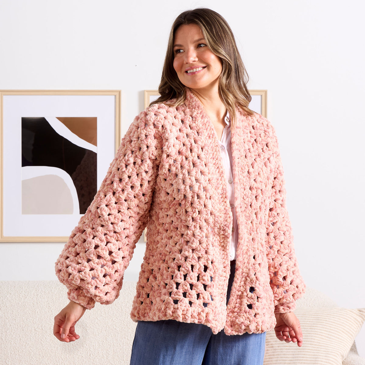 Hexi Hug Crochet Blanket Cardigan made using Bernat yarn in a styled lifestyle setting