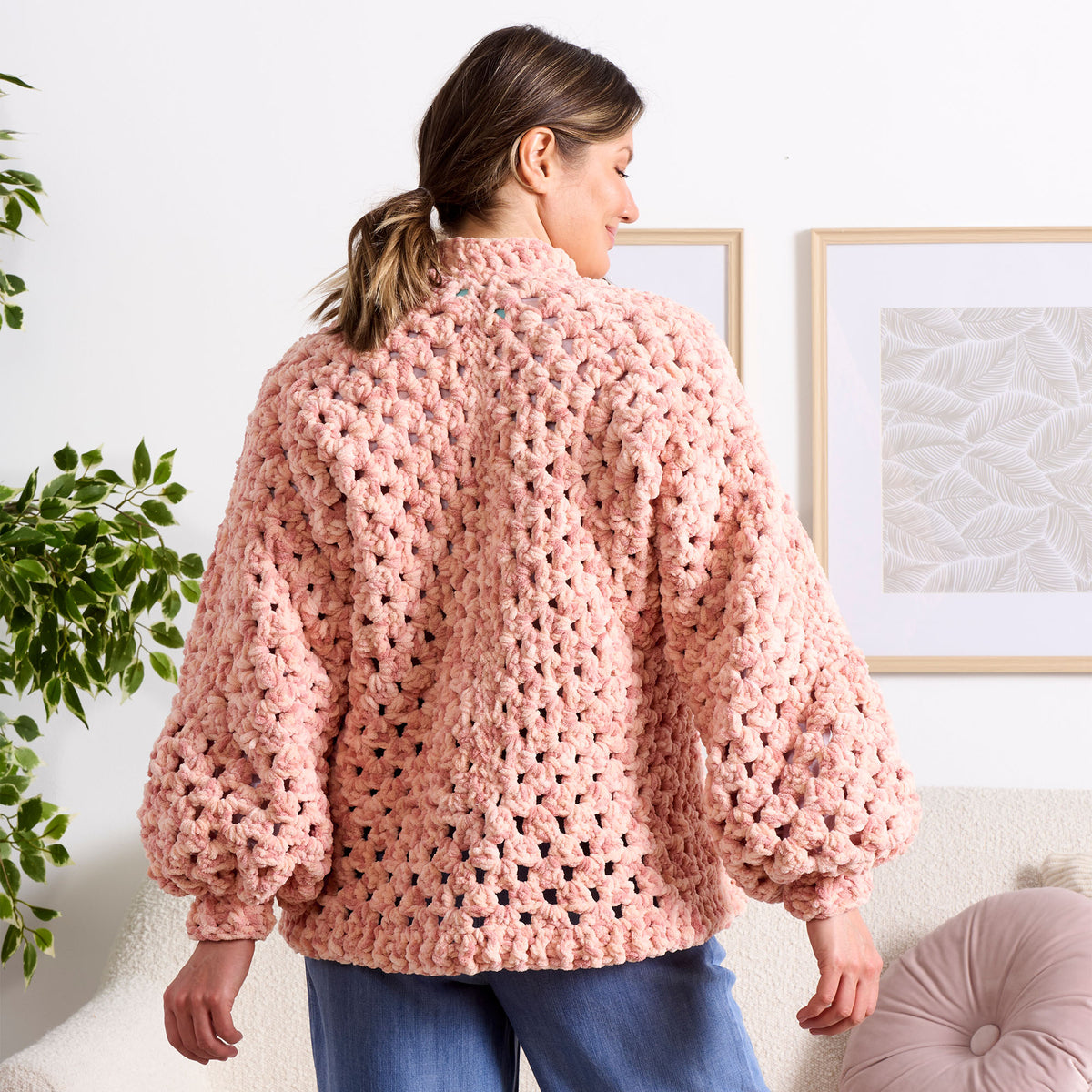 Hexi Hug Crochet Blanket Cardigan made using Bernat yarn in a styled lifestyle setting
