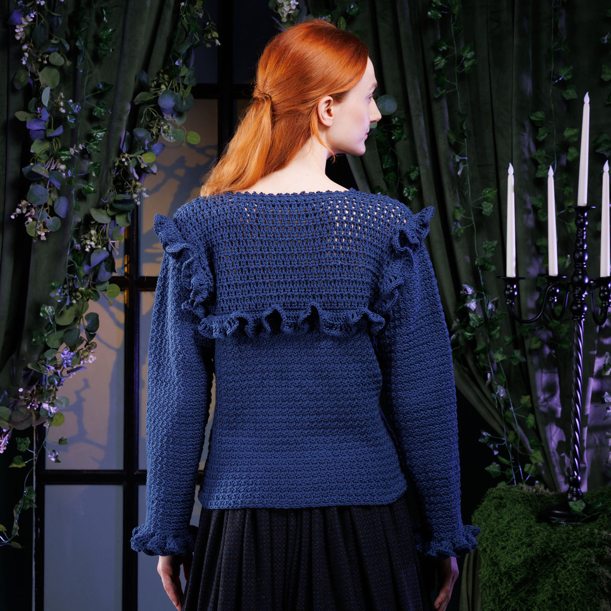 Crochet Vintage Ruffle Top made using Bernat yarn in a styled lifestyle setting