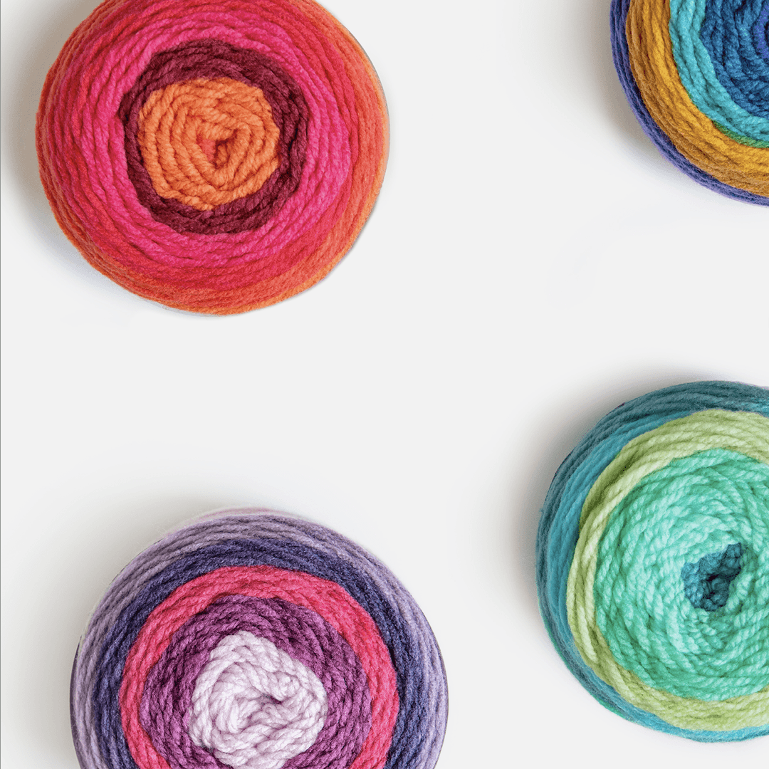 Bernat brand's yarns on a white background.