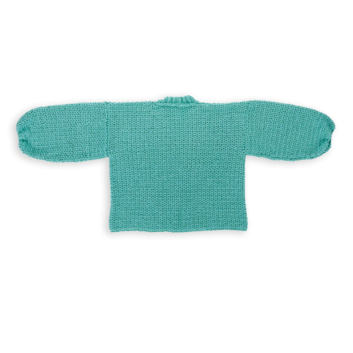 Nice And Easy Crochet Cardigan made using Caron yarn in a styled lifestyle setting