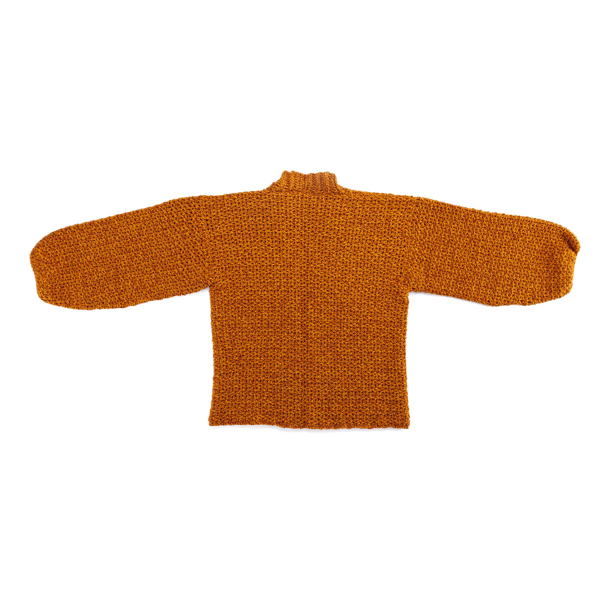 Nice And Easy Crochet Cardigan made using Caron yarn in a styled lifestyle setting