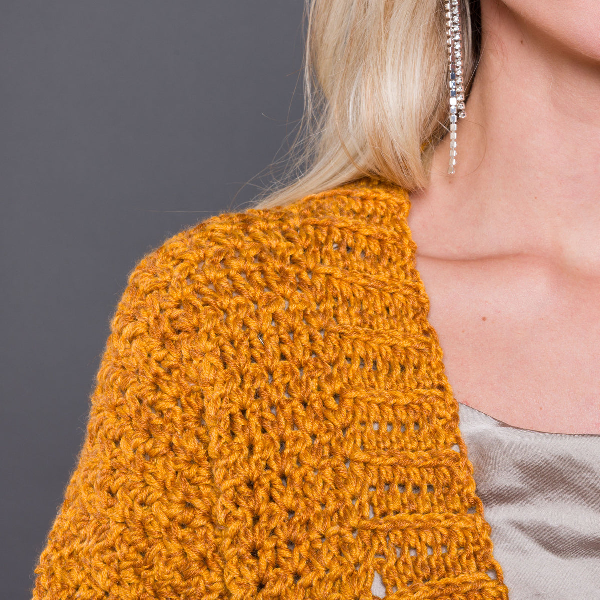 Nice And Easy Crochet Cardigan made using Caron yarn in a styled lifestyle setting