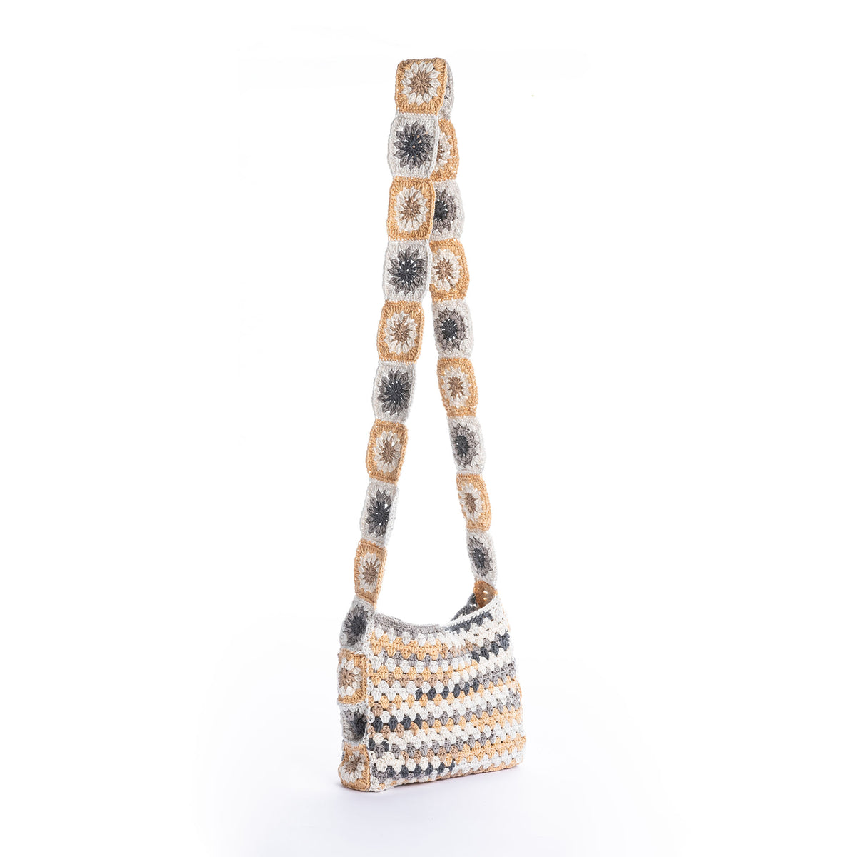 Crochet Tie Top Tote made using Caron yarn on a white background