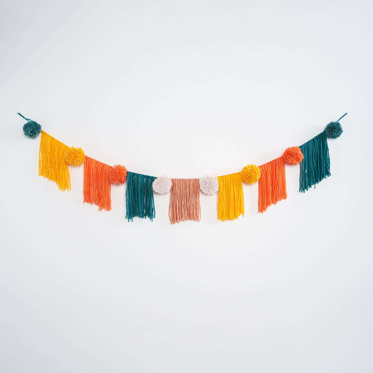 Fringe & Pompom Bunting made using Caron yarn