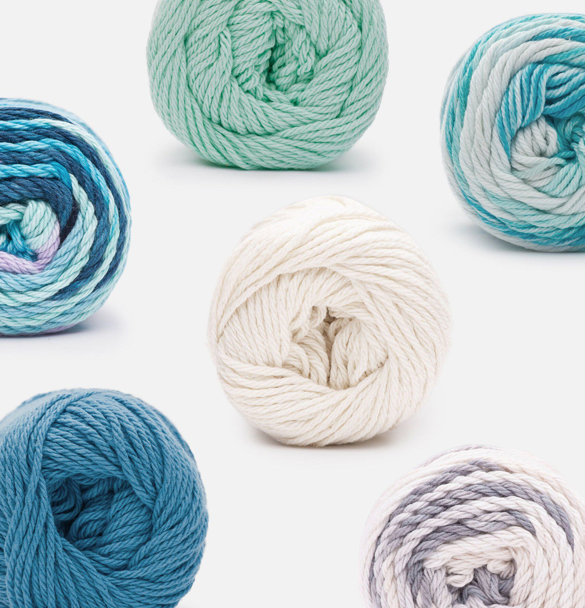 Peaches & Cream brand's yarns on a white background.