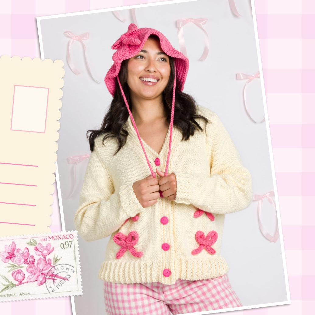 Trend Alert Bows pattern collection banner featuring a woman wearing a bow hat and bow cardigan made with Caron yarns.
