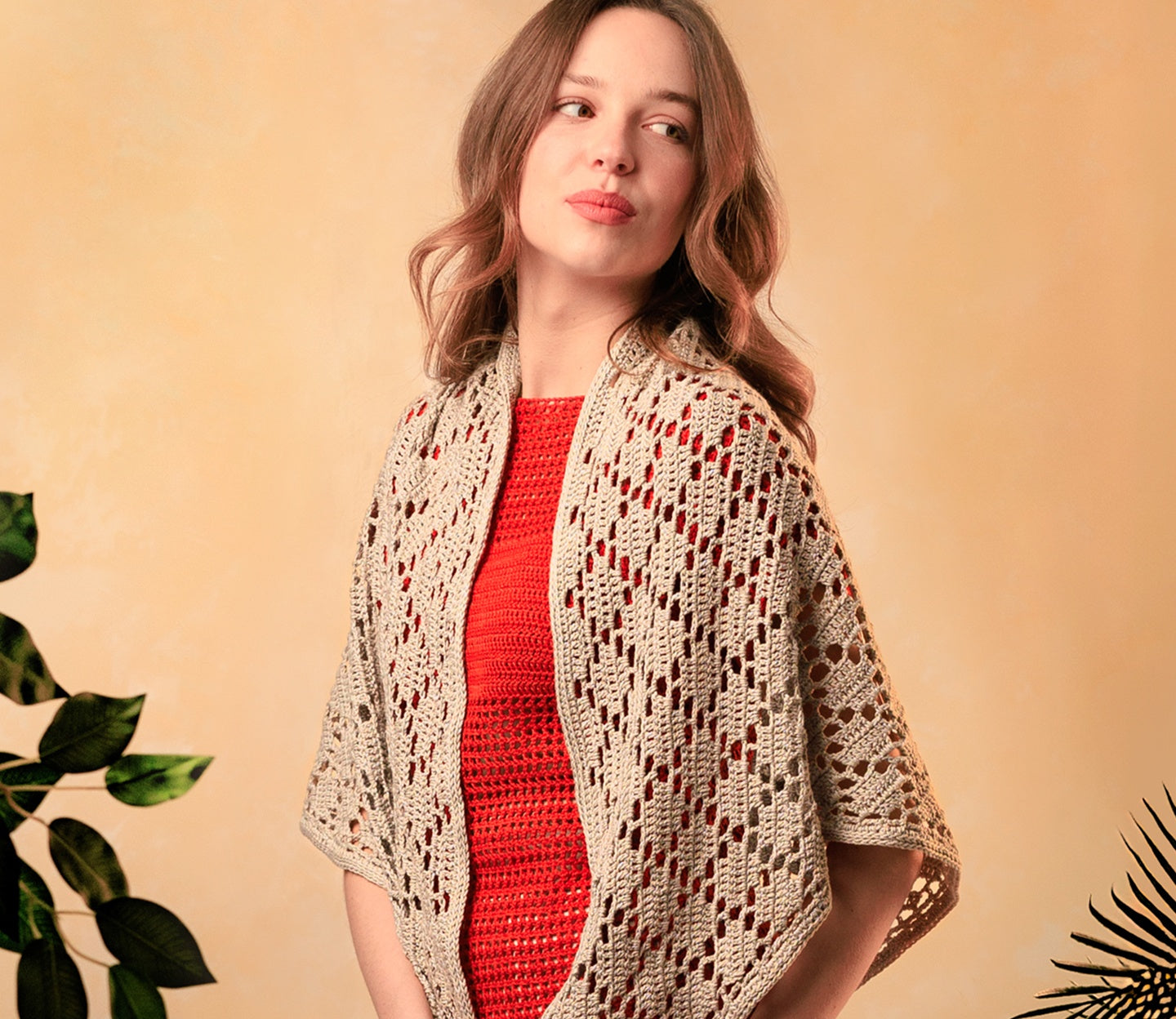 A women wearing a dress and a scarf made using Patons yarns.