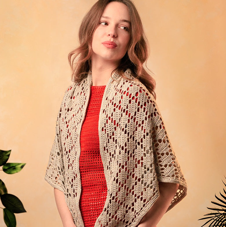 A women wearing a dress and a scarf made using Patons yarns.