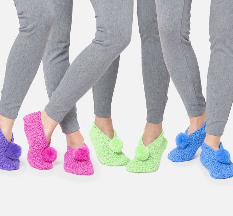 models wearing crochet slippers with pom pom in different colors