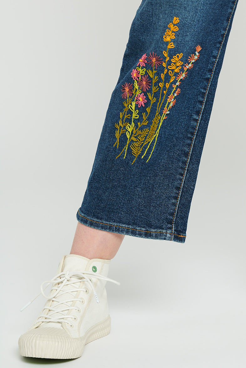 Hand embroidery of flowers on jeans