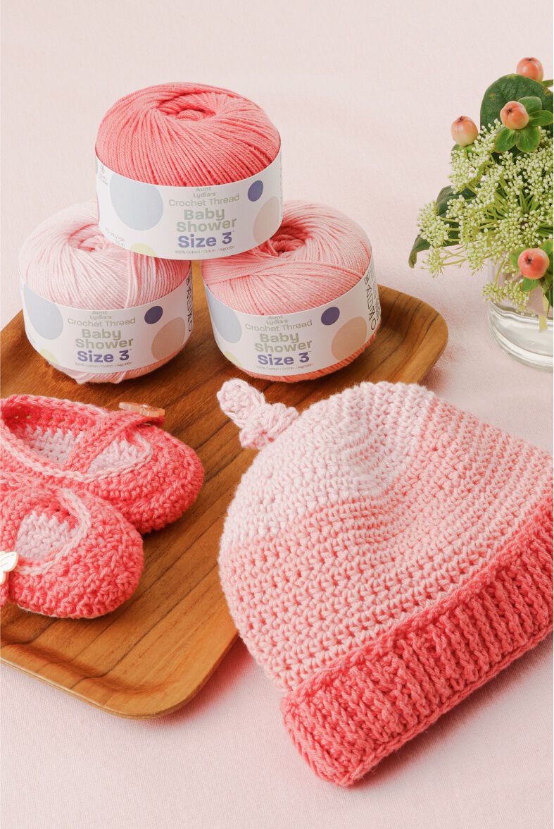 Coral hat and booties with thread