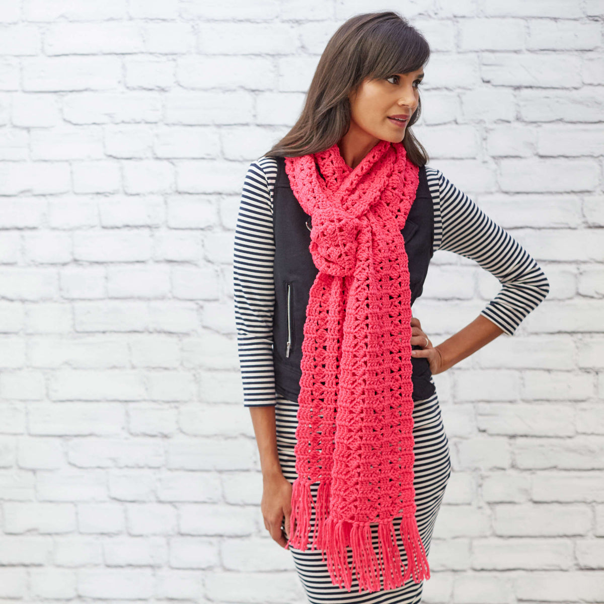 Crochet Cosmo Scarf made using Red Heart yarn in a styled lifestyle setting