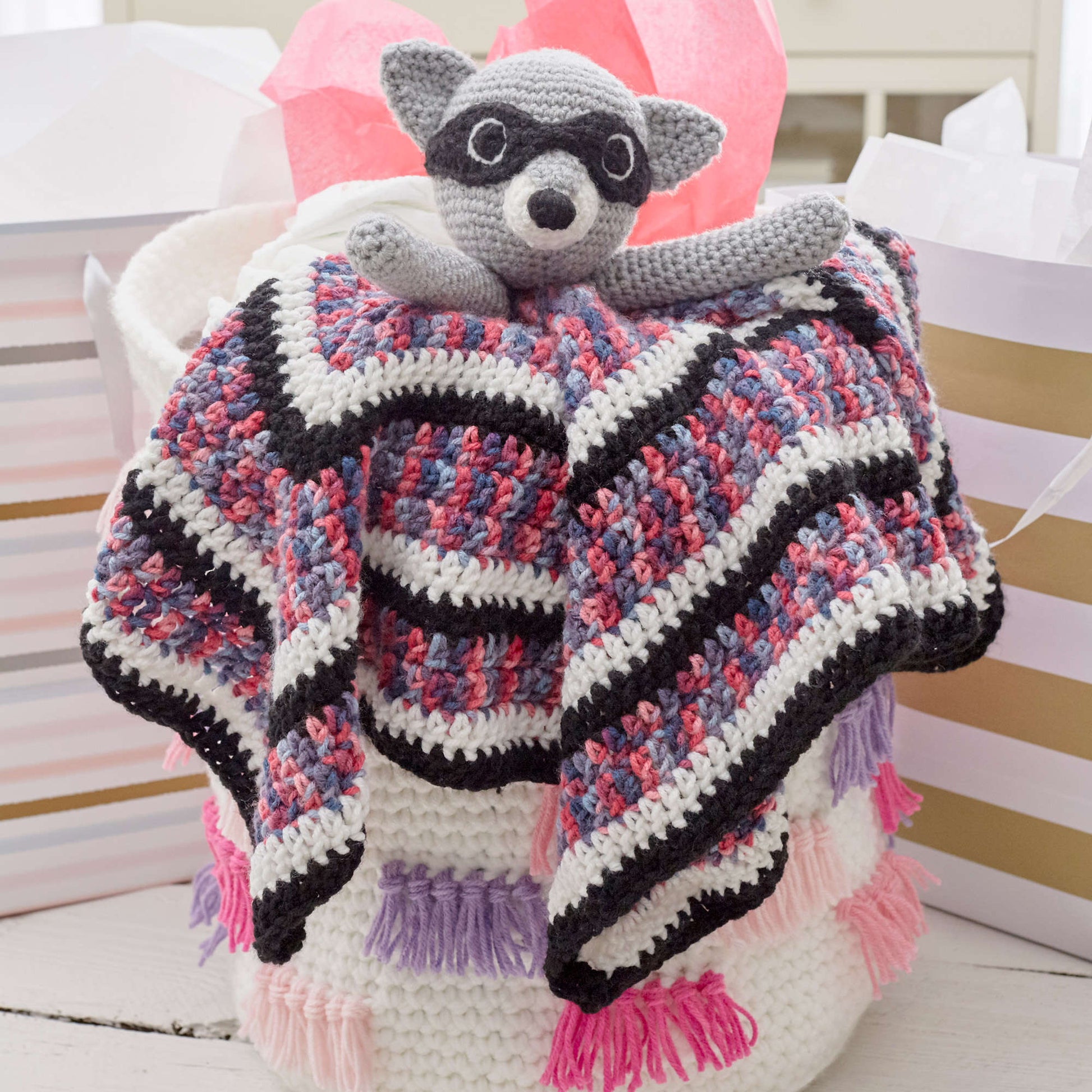 Free Red Heart Raccoon Crochet Lovey Pattern