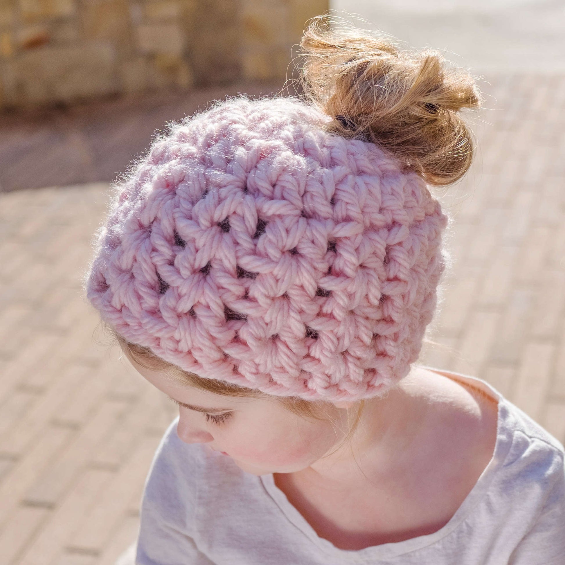 Free Red Heart Crochet Childs' Messy Bun Hat Pattern