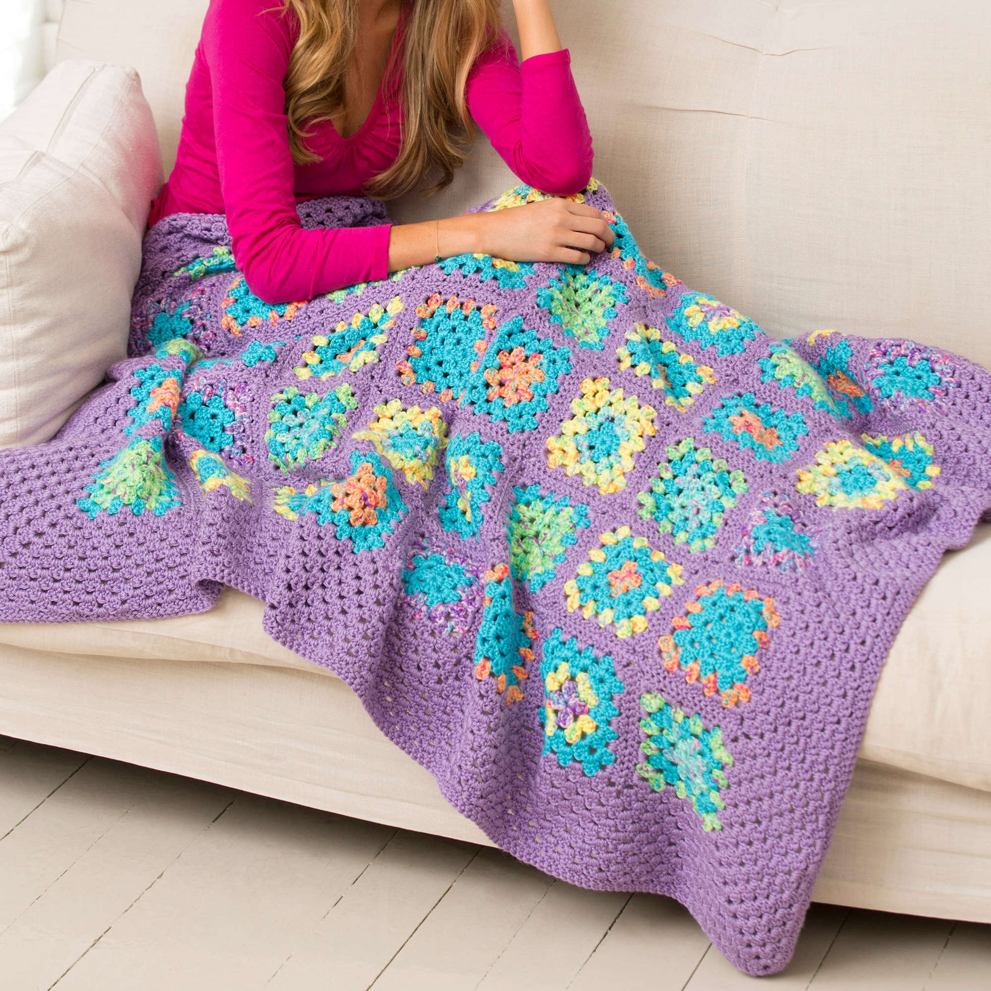 Free Red Heart Cheerful Granny Square Throw Crochet Pattern