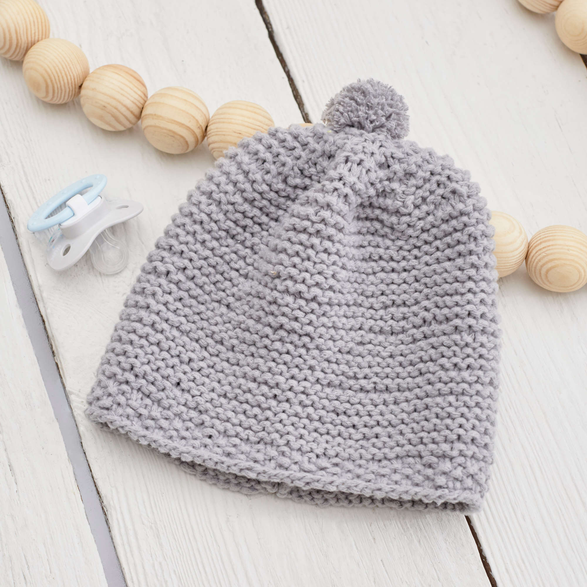 Free Easy Red Heart Happy Place Baby Hat Knitting Pattern | Yarnspirations