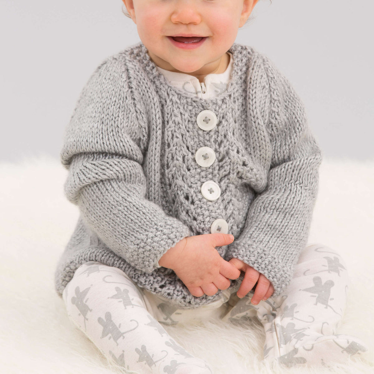 Knit Cardigan made in Red Heart Soft Baby Steps Yarn