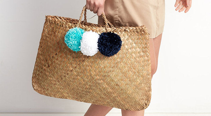 Image of Adding Pompoms to a Straw Bag thumbnail