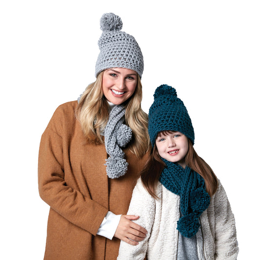 Woman and child wearing crochet hats and scarves on a white background