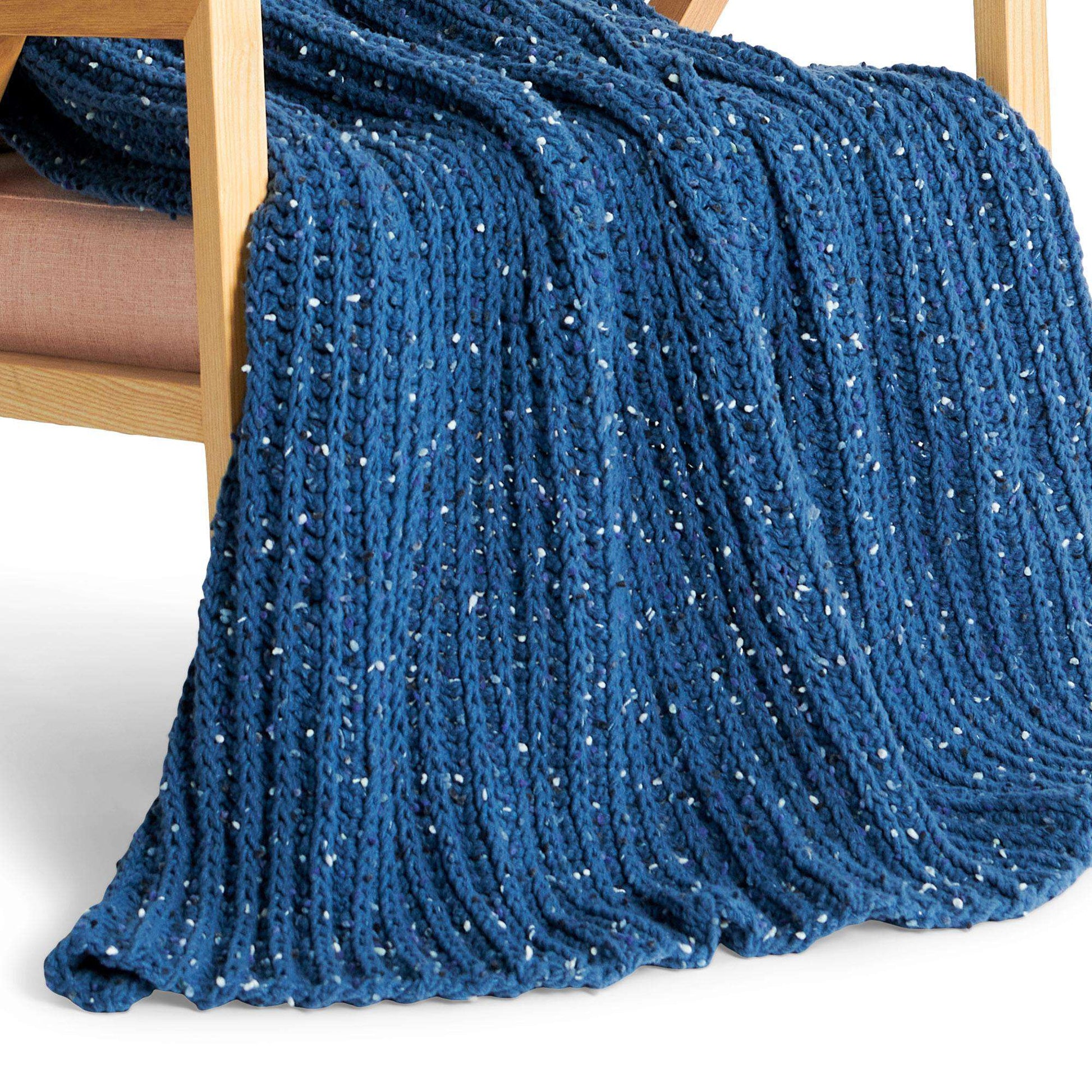 Bernat blanket yarn, chunky 6 weight with 10mm crochet hook. Half doub