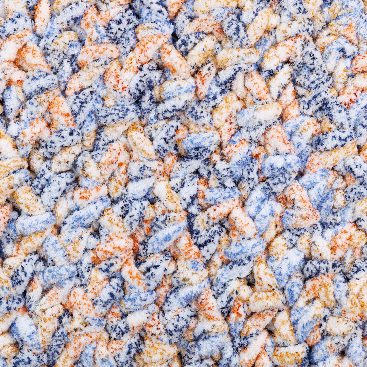 Big textured crochet blanket made using Bernat yarn.