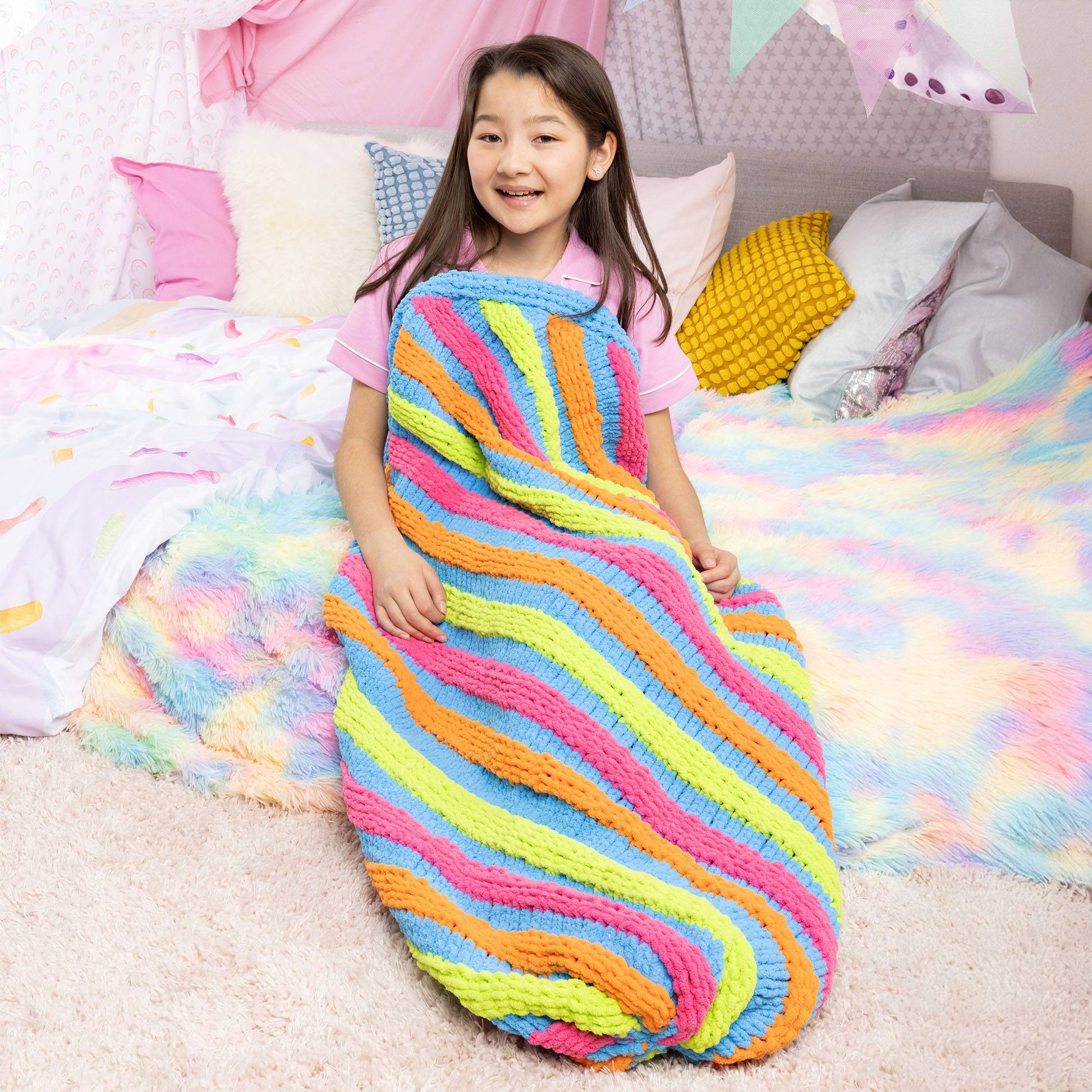 Free Easy Bernat Rainbow Swirl Knit Snuggle Sack Pattern | Yarnspirations