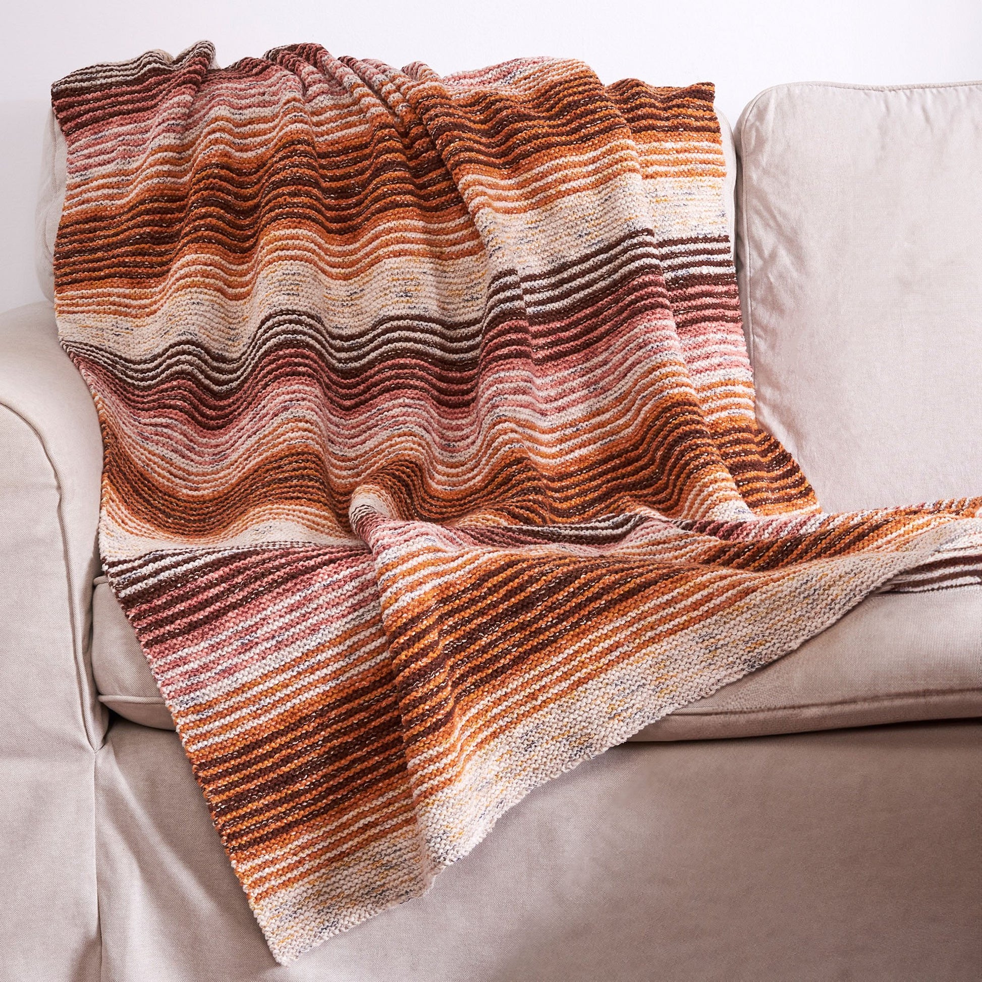Free Bernat Tweedy Striped Knit Blanket Pattern
