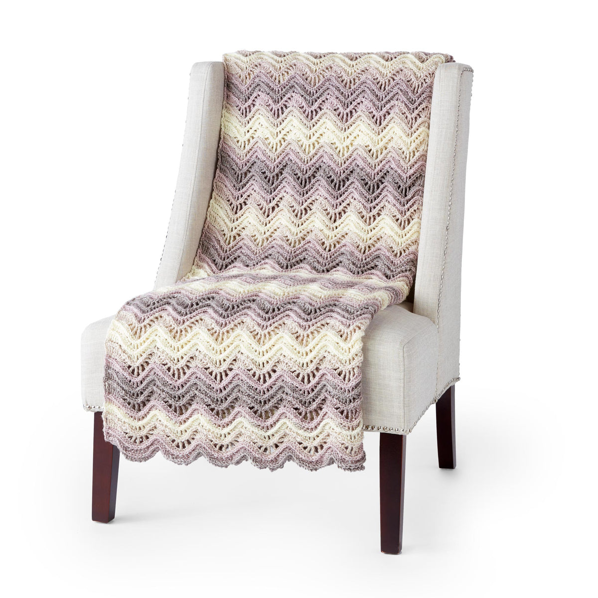 A beautiful crochet ripple ridges blanket made using Caron Jumbo Ombre Yarn.