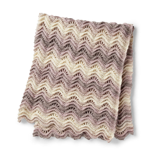 A beautiful crochet ripple ridges blanket made using Caron Jumbo Ombre Yarn.