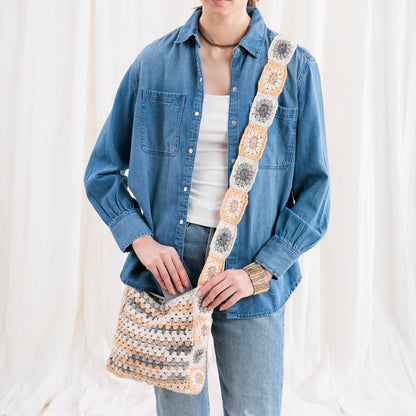 Caron Crochet Tie Top Tote Crochet Tie Top Tote made using Caron yarn in a styled lifestyle setting