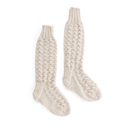 Patons Cabin Cable Knit Socks Pair of beige knitted socks using Patons yarn.