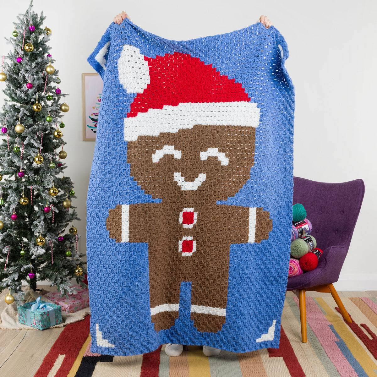 Red Heart gingerbread friend Crochet Blanket made using Super Saver yarn.