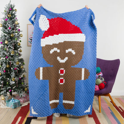 Red Heart Gingerbread Friend Crochet Blanket Red Heart gingerbread friend Crochet Blanket made using Super Saver yarn.