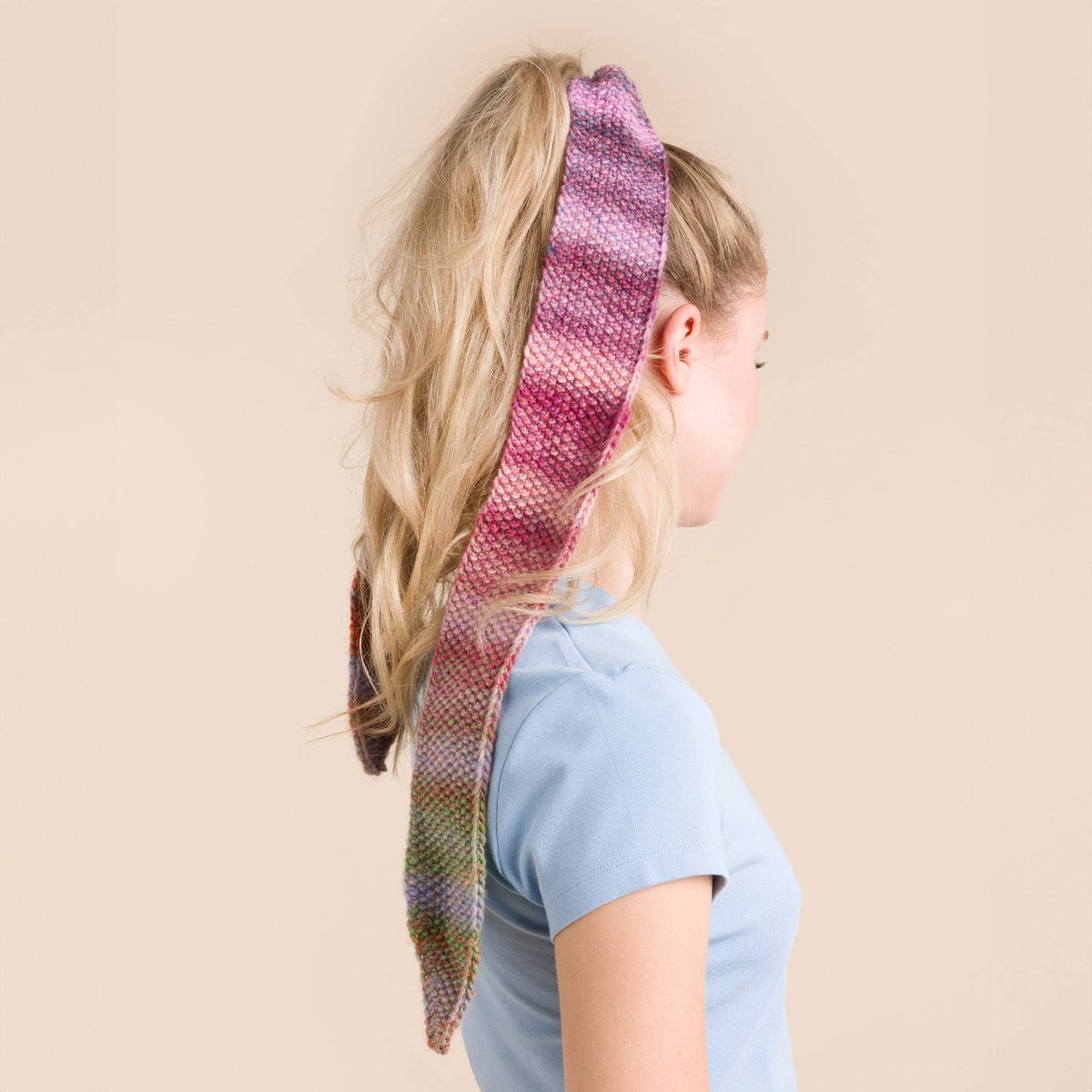 Knit Bow made in Red Heart Roll With It Melange Yarn