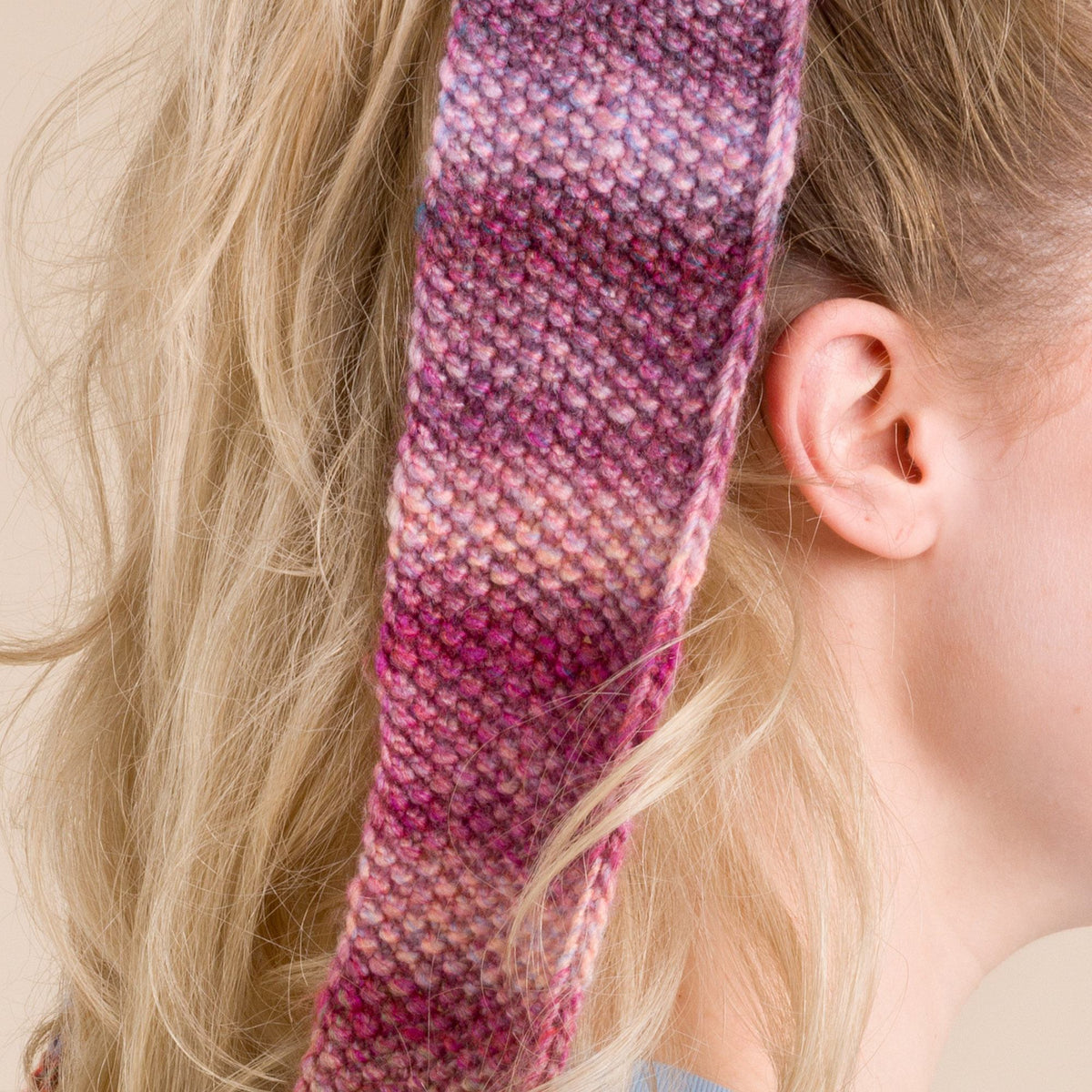 Knit Bow made in Red Heart Roll With It Melange Yarn