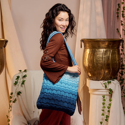 Red Heart Coastal Life Knit Bag Coastal Life Knit Bag made using Red Heart yarn in a styled lifestyle setting