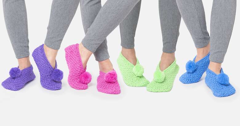 models wearing crochet slippers with pom pom in different colors