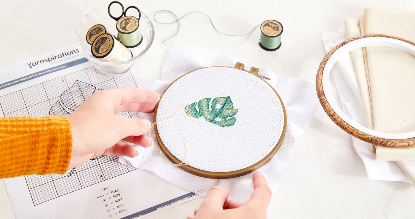 work in progress of monstera leaf cross stitch