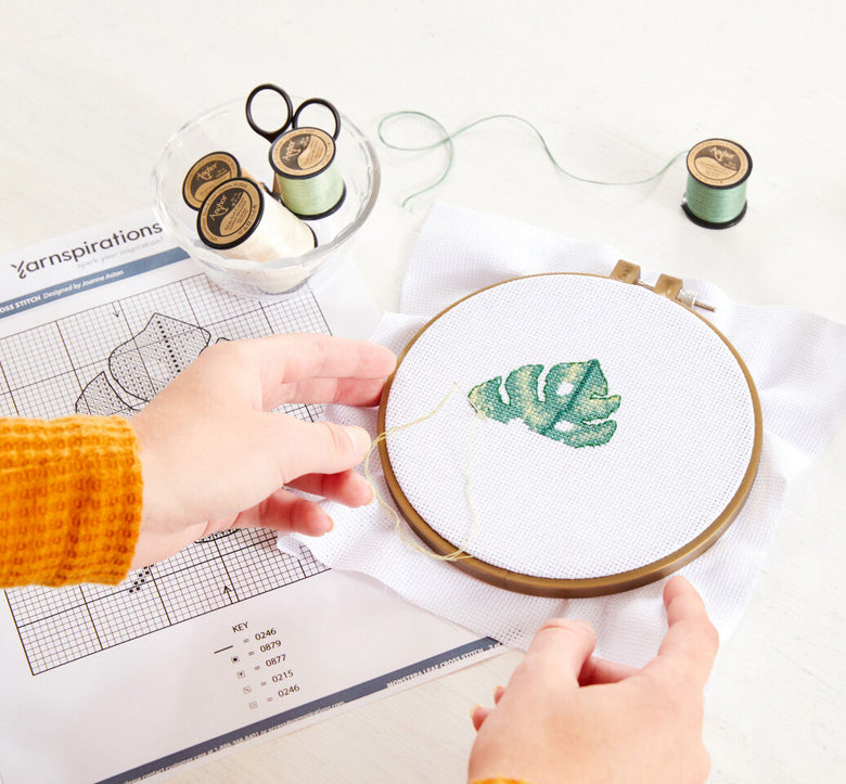 work in progress of monstera leaf cross stitch