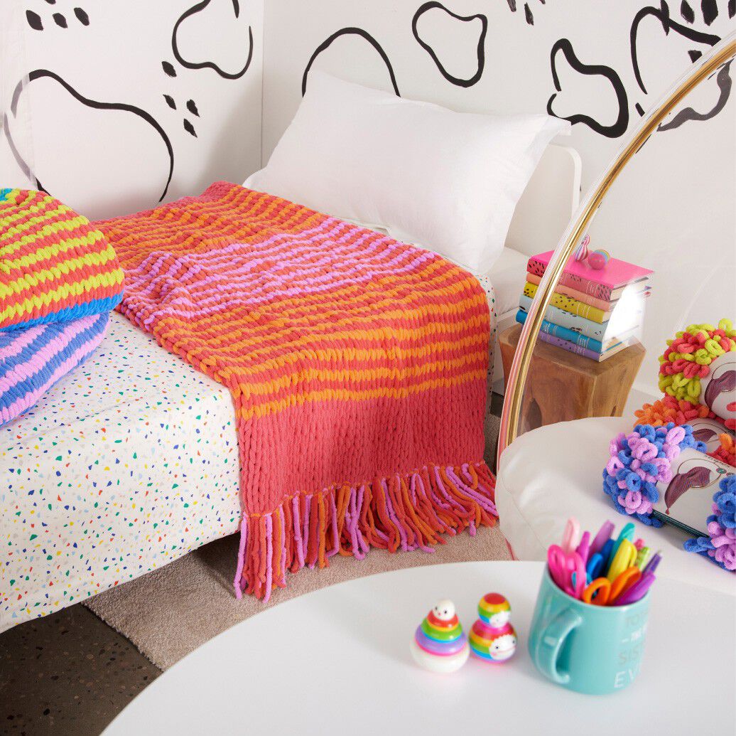 Colorful EZ Stripes blankets in bedroom