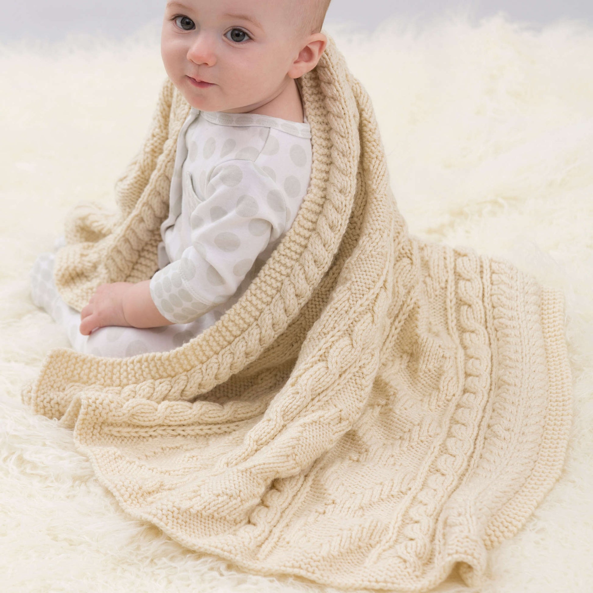 Free Red Heart Baby Loves Cables Throw Knit Pattern