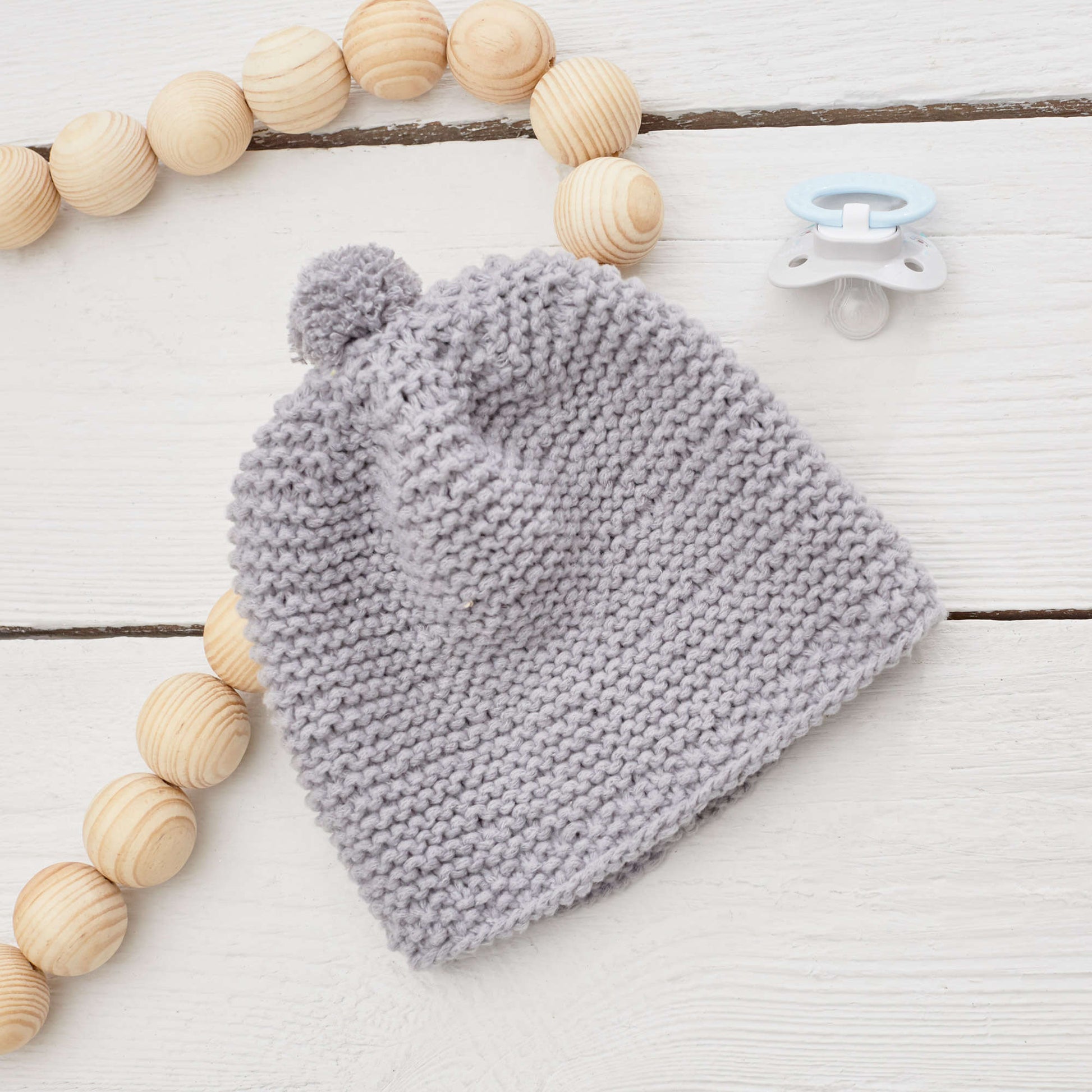 Free Red Heart Happy Place Baby Hat Knit Pattern