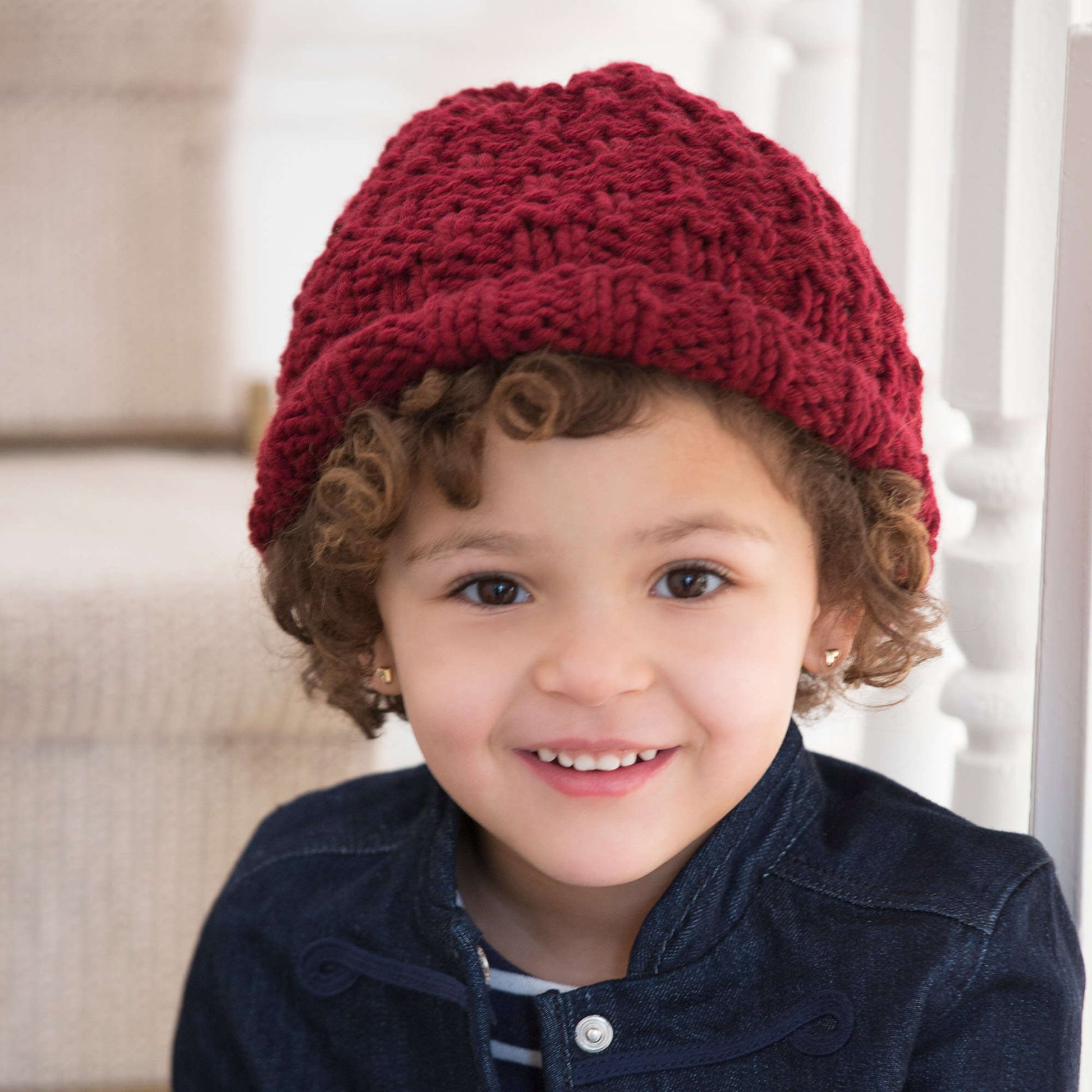 Free Red Heart Child's Rolled Brim Hat Knit Pattern
