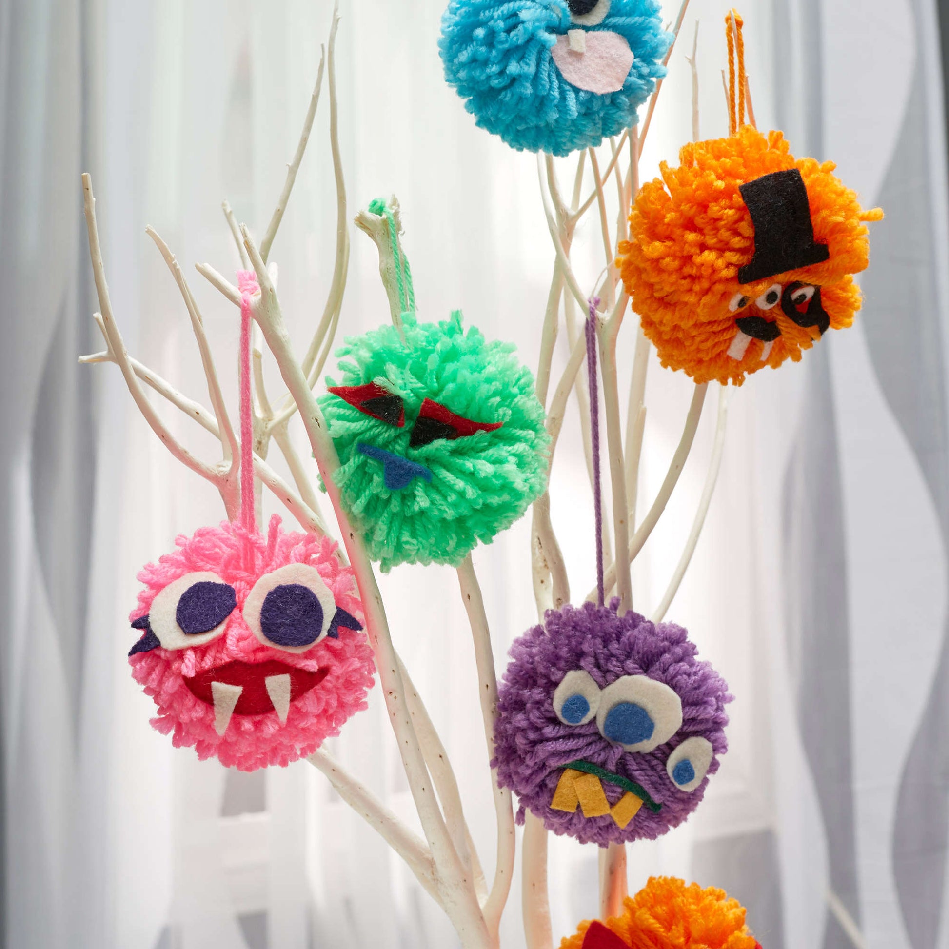 Free Red Heart Pompom Monsters Pattern